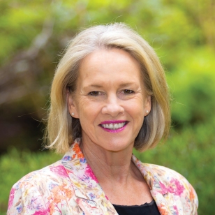 The Hon Fiona Nash with short hair, wearing a jacket and smiling